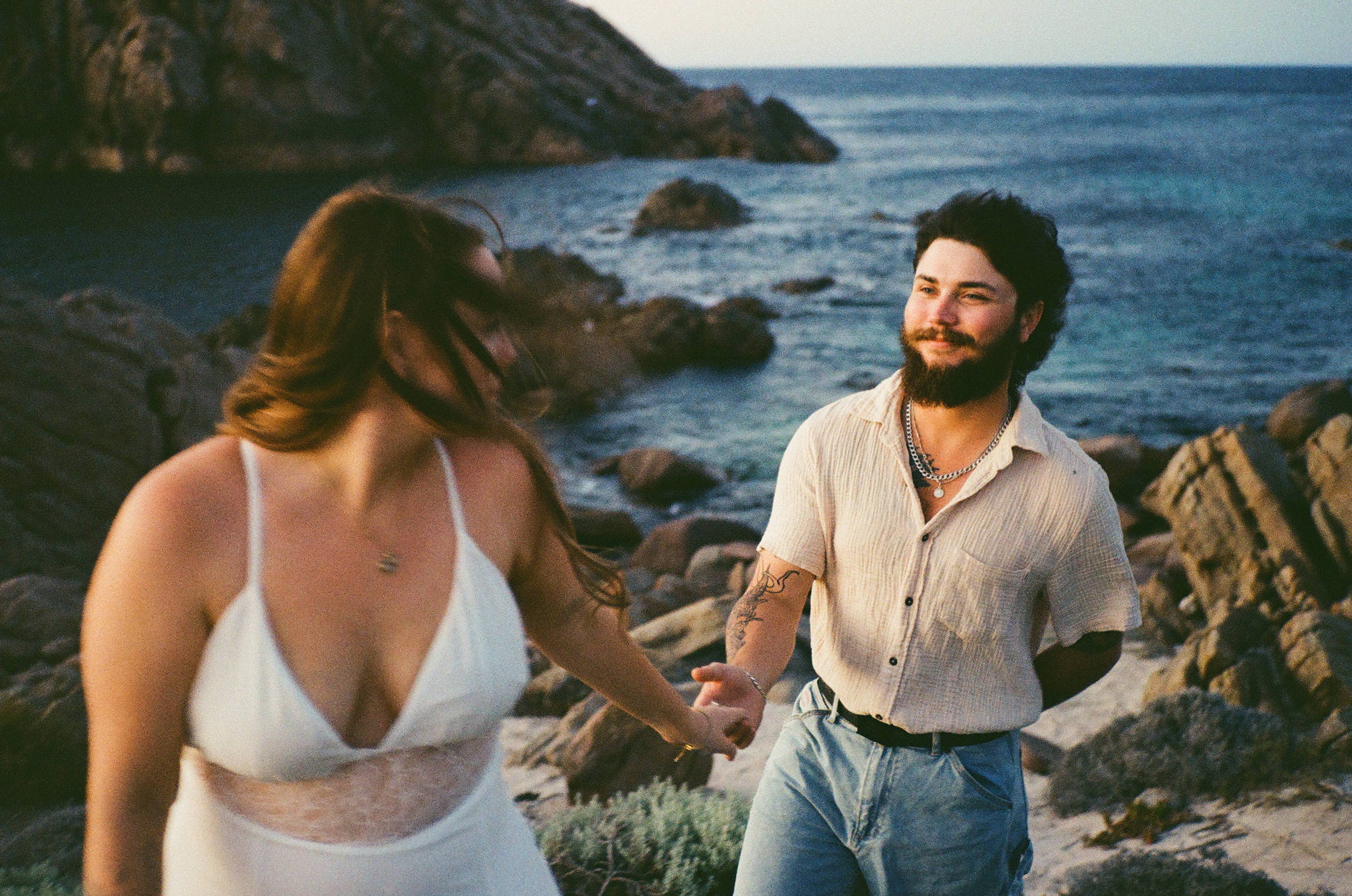 Cameron and Taylah embracing after their Dunsborough proposal