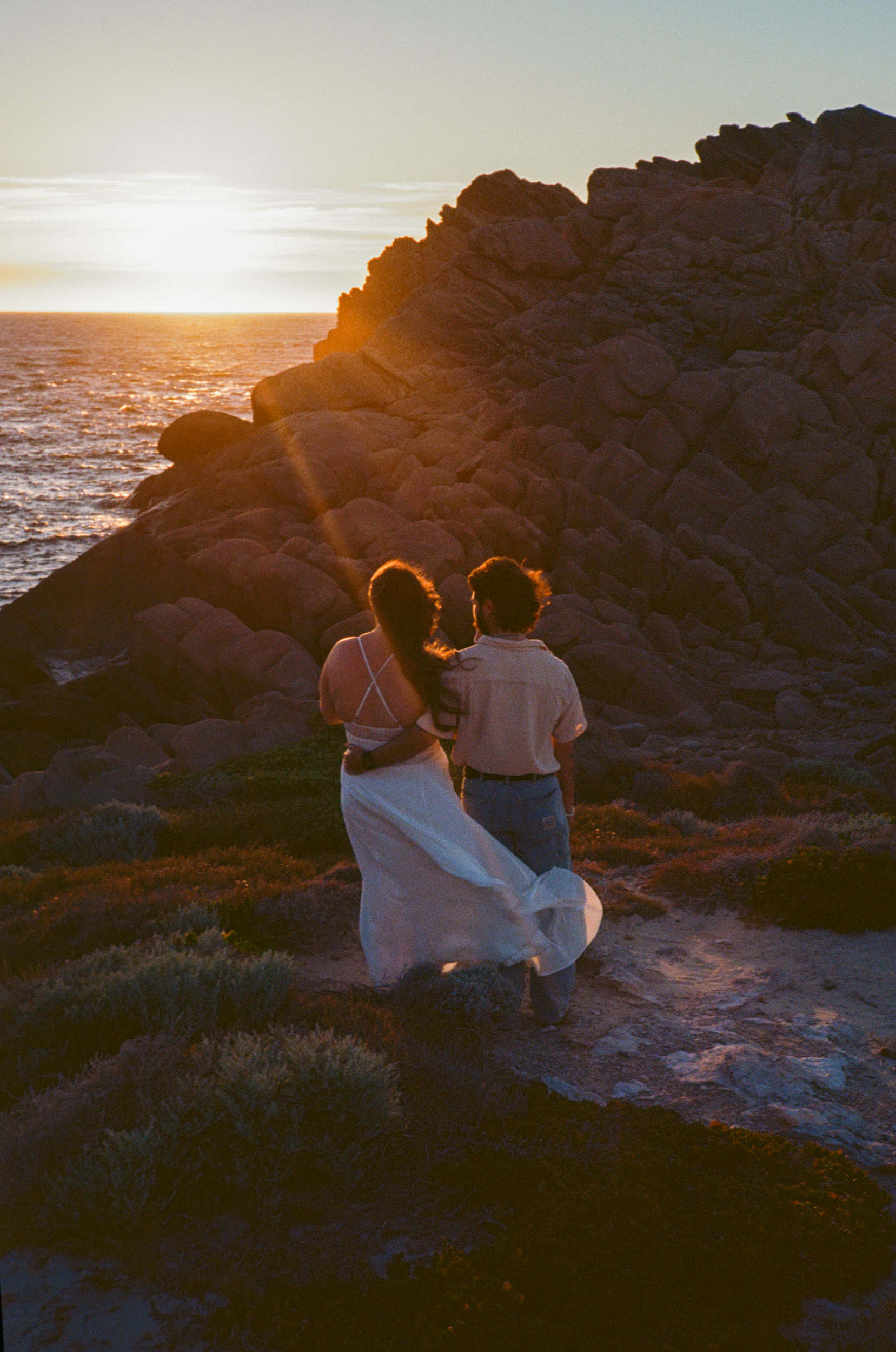 Romantic film photograph of a couple after their Sugarloaf Rock proposal